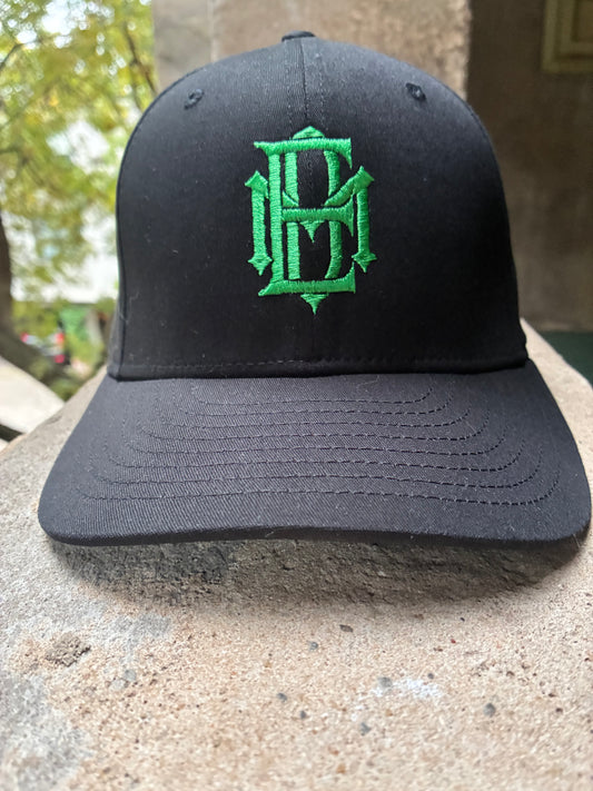 Black cap with green EMD embroidered logo